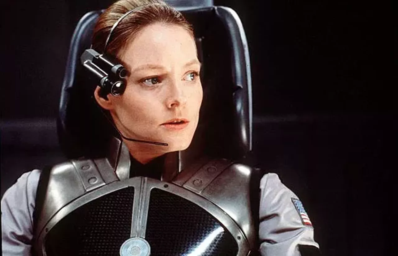 23. Contact (1997) From our 1997 review: Adapted from the Reagan-era bestseller written by the late public-TV astro-populizer Carl Sagan, this account of the most benign interplanetary interaction since the heyday of E.T. falls somewhere between the golden anniversary of the Roswell Event and NASA's own summer blockbuster, Pathfinder on Mars. Mainly, however, it's a search for the lost daddy -- a spectacle at once laughable and glum. &para; The orphan of Bedford Falls, astrogenius Ellie Arroway (Jodie Foster), has developed her precocious interest in ham radio to an obsessive search for life in the cosmos, most pithily (if pitifully) summarized by the flashback to her prepubescent postfuneral shortwave plea: "Dad -- are you there?" Never less than earnest, even when enjoying a postcoital snuggle with resident hunk Matthew McConaughey, Foster battles the bureaucratic blob blocking her "journey to the heart of the universe," but seems most at home in the role of a grade-school teacher. She's a gracious fount of wisdom who ends the movie posed as Rodin's Thinker. -- J. Hoberman