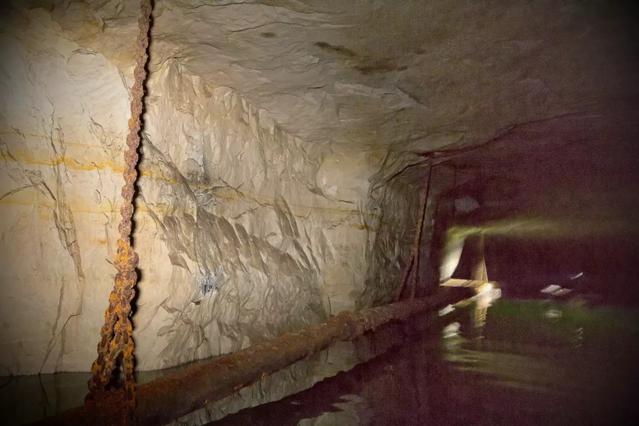 In a section that Marsan deems too hazardous to include on his tour, rusted chains, pipes and wires rust away above the water's surface.