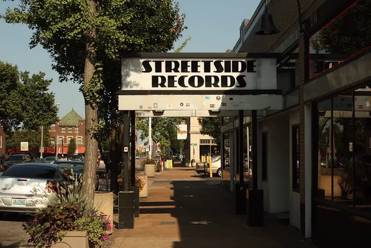 Streetside Records If you wanted a record store with a great selection that had none of the annoying record store vibes, Streetside Records was your favorite place in St. Louis. Instead of hiring only music nerds, this place also hired kids who were happy to help customers — but also happy to goof off a bit, too. The CD selection was primo and because they bought CDs off of the public, the selection was always changing, too. It was like each Streetside location had a whole new inventory each week, which kept St. Louis shoppers coming back for more. This photo shows the ones that was on the Loop, near the Tivoli. (RIP to the Tivoli, too.)