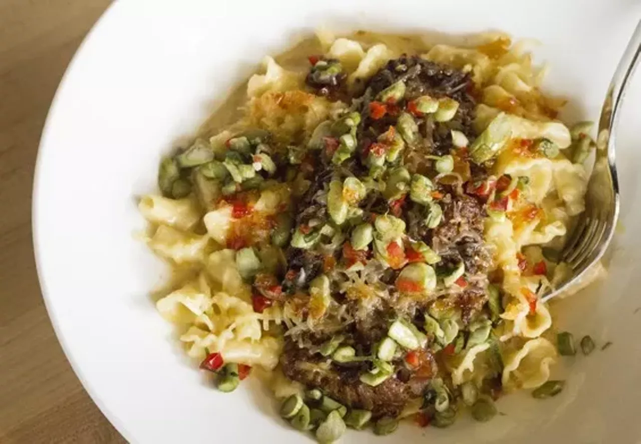 Walnut Grill Locations in Ellisville and O'Fallon, Missouri Have you ever had "Thai Pork Mac n' Cheese"? We doubt it. But at Walnut Grill you can get just that, served with four cheese alfredo, Thai-seasoned pulled pork, asparagus relish, sweet chili sauce and smoked gouda. Walnut Grill's mac and cheese was also a favorite at our Mac and Cheese Throwdown, notching third place in the People's Choice awards. Photo by Mabel Suen.
