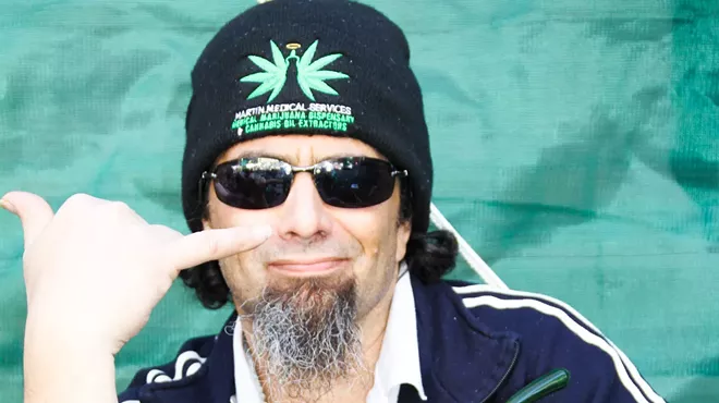 Stoner guys throws the "hang loose" sign.