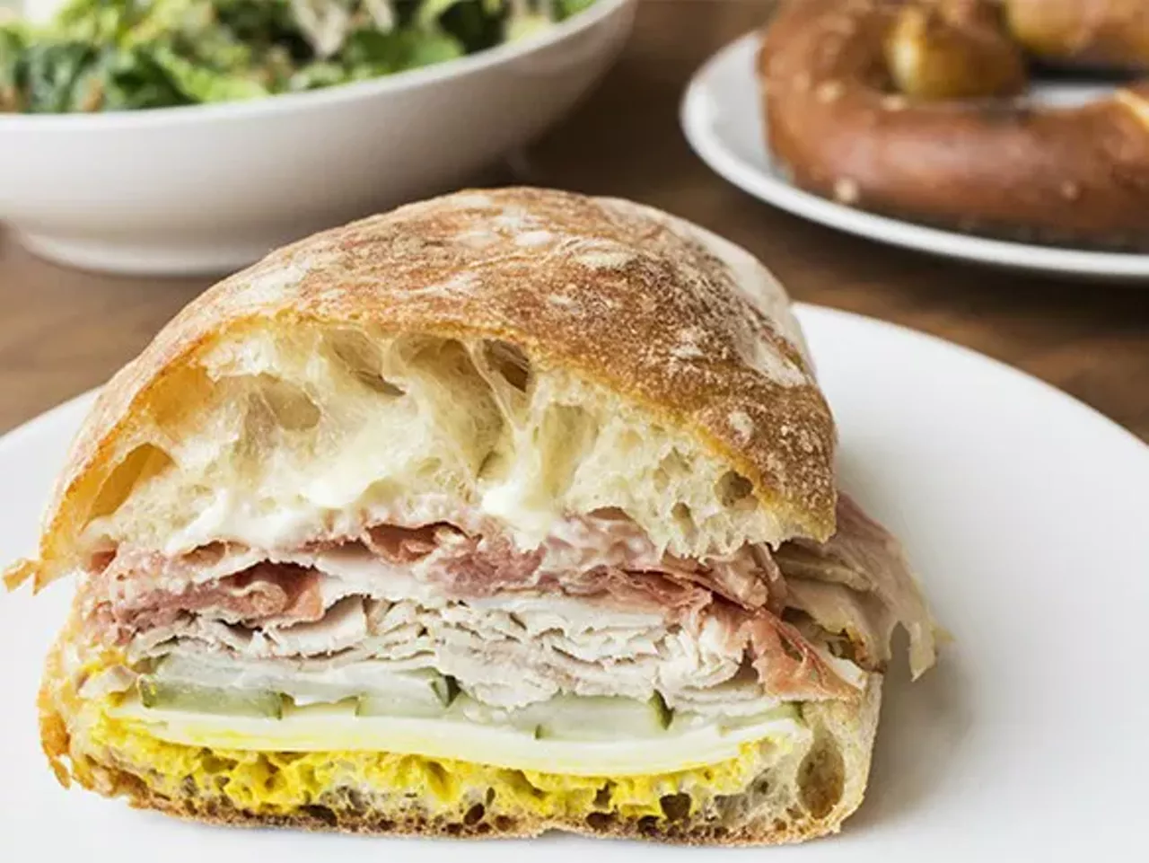 Union Loafers (1629 Tower Grove Avenue, 314-833-6111) Crusty flour-dusted ciabatta is the base for the restaurant's signature sandwich, the roasted pork. Thin slices of rosemary-kissed pork tenderloin; creamy, prosciutto-like country ham; and crisp pickles are accented with rustic grain mustard. Perhaps the best part of the sandwich is when the liberally slathered housemade garlic mayonnaise squishes out through the bread's little cracks. - Cheryl Baehr Photo credit: Mabel Suen