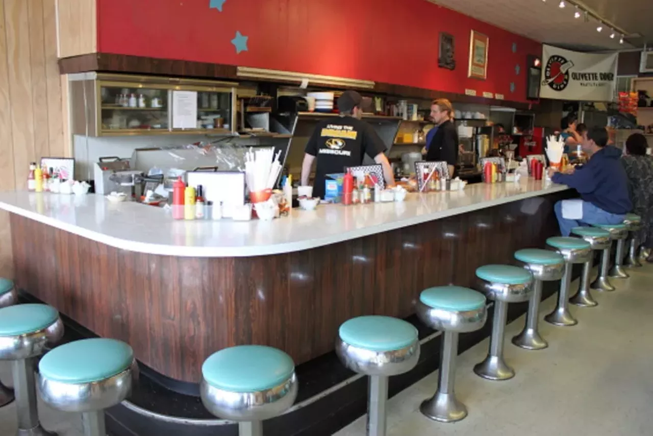 Olivette Diner 9638 Olive Blvd. St. Louis, MO 63132 (314) 995-9945 Slide into a vinyl booth or swipe a seat at the counter at Olivette Diner to enjoy a burger, slinger or whatever suits your fancy. Located in a strip mall, Olivette Diner serves breakfast and lunch along with a side of friendly service. No wonder customers come back again and again. Photo via RFT archives.