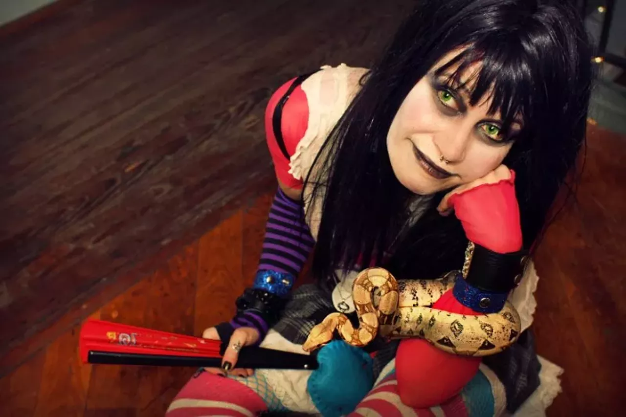 Ami Amore takes a break with her snake, Trance.