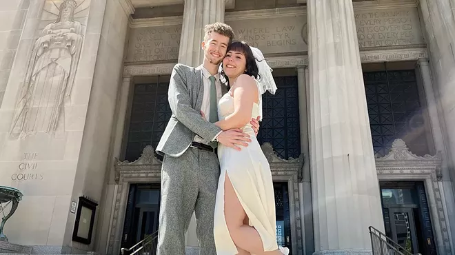 Adam Jehle, 20, and Julia Lima, 18, standing outside of the courthouse after getting married.