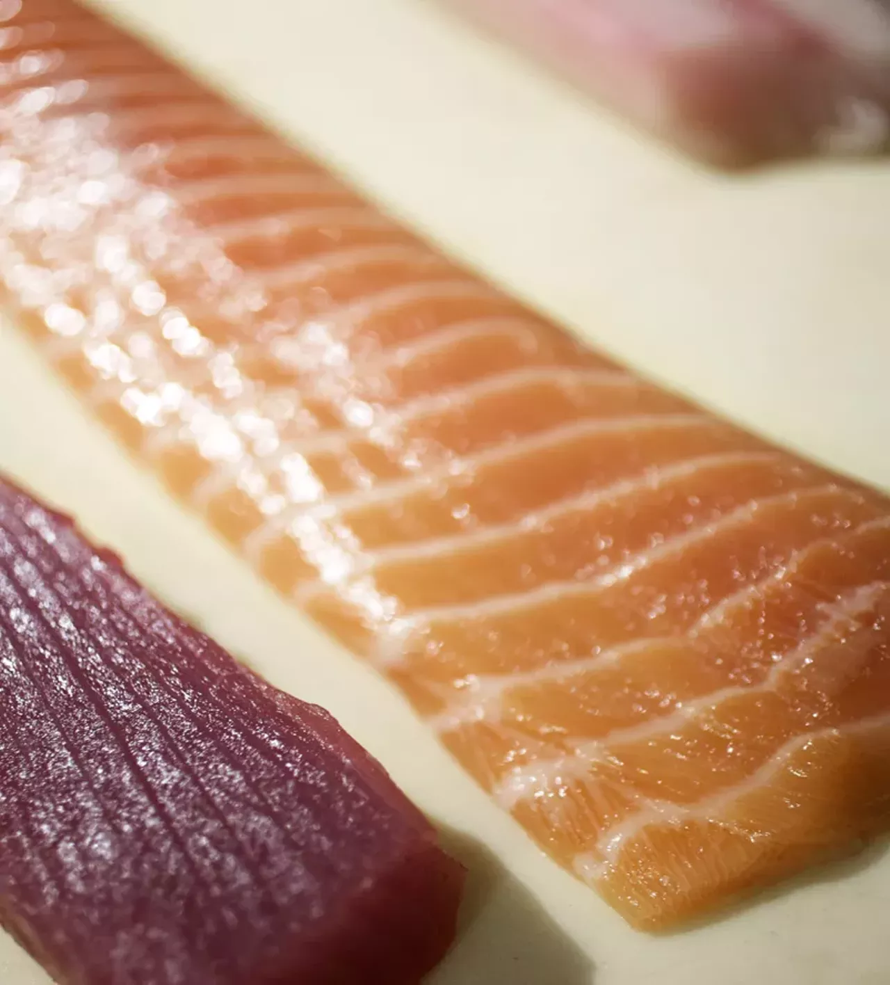 Tuna and salmon ready for slicing.