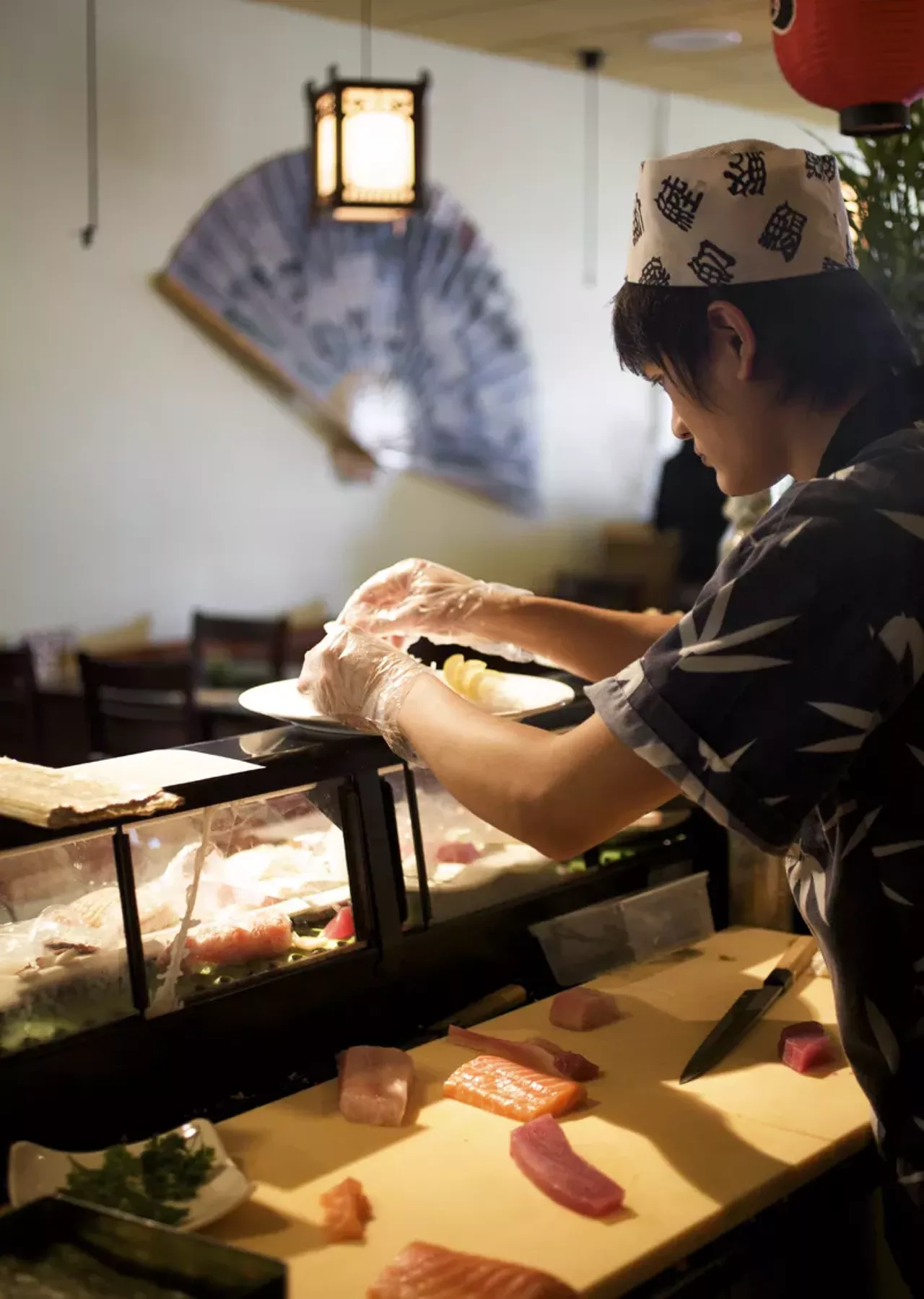 One of the owners, Jake Dong plating at the sushi bar.