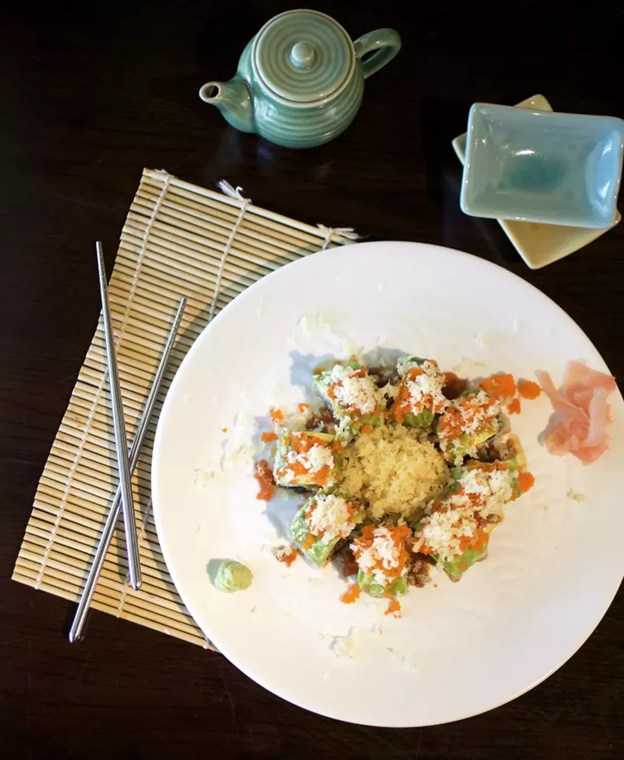 The Green Dragon Roll is eel, cucumber and avocado topped with masago and tepura flakes.