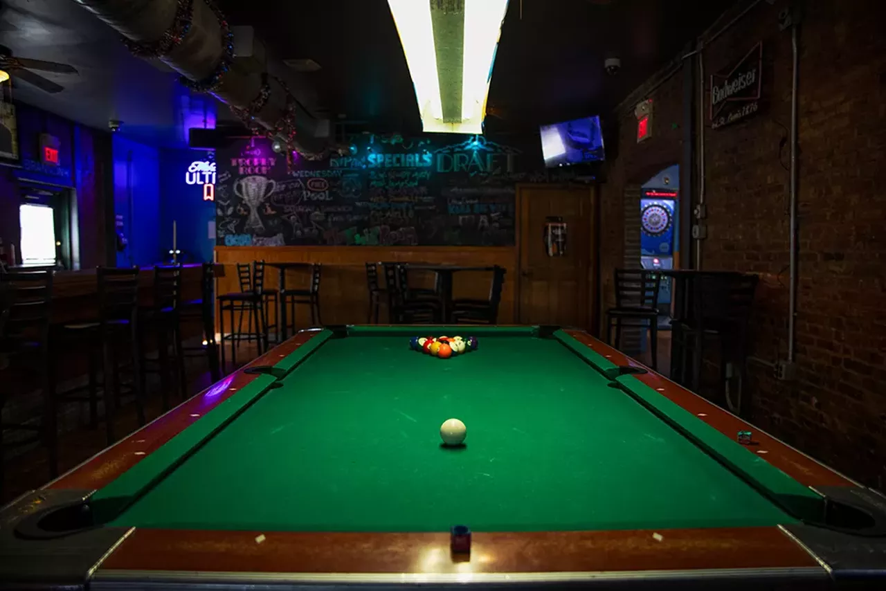 Though Trophy Room (5099 Arsenal Street, Southwest Garden) sometimes feels like its clientele is roughly half cops and half would-be criminals, the pool scene sees a casual crowd of regulars who like to come in and play on Wednesdays (yep, it&rsquo;s free on Wednesdays). Any other night, the table costs .75 cents for a game. A sign fits upon the table and reads &ldquo;Eight ball, call your shot, single players only, challengers sign up on chalkboard.&rdquo; So if you&rsquo;re looking for a friendly, yet slightly competitive game, place your name on the board and wait your turn. Trophy Room is open from 6 a.m. to 3 a.m. Monday through Saturday and 11 a.m. to 3 a.m. Sunday.