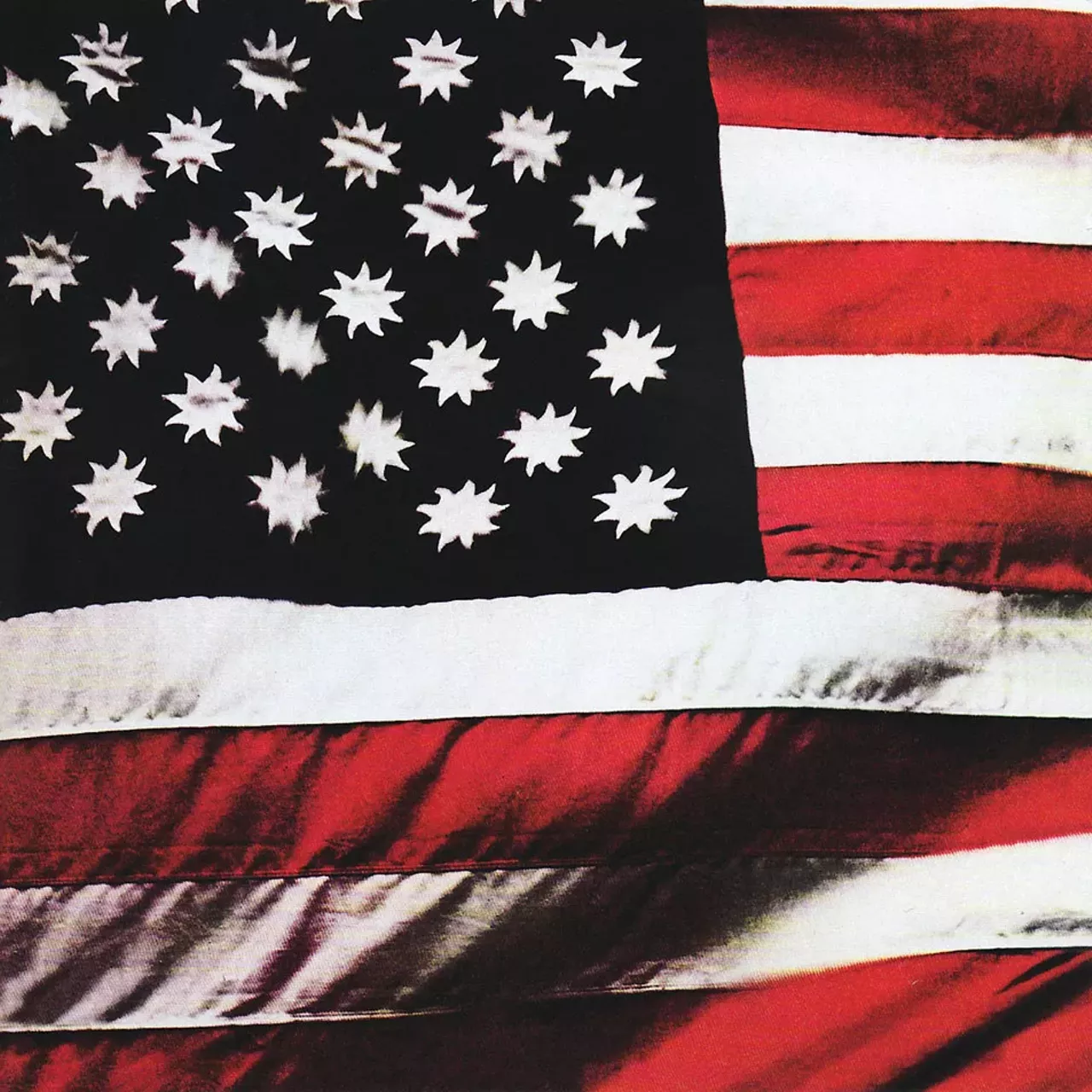 Sly and the Family Stone - There's a Riot Goin' On (1971) There's a Riot Goin' On by Sly and the Family Stone, released in 1971. The original art had a red, white and black flag with suns instead of stars. Sly told a fan website, "Betsy Ross did the best she could with what she had. I thought I could do better."