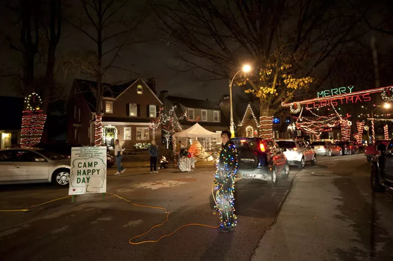 Missey Doll of St. Louis functions as traffic control and decor on "Candy Cane Lane."