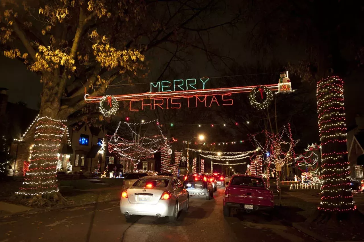 Cars slowly drove down the 6500 block of Murdoch Avenue in South City (transformed into "Candy Cane Lane" for Christmas) on Wednesday night to take in the sights and stop for donations to Camp Happy Day.