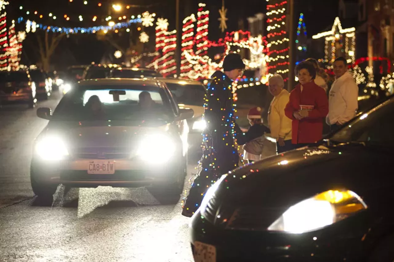 Missey Doll of St. Louis functions as traffic control and decor on "Candy Cane Lane."