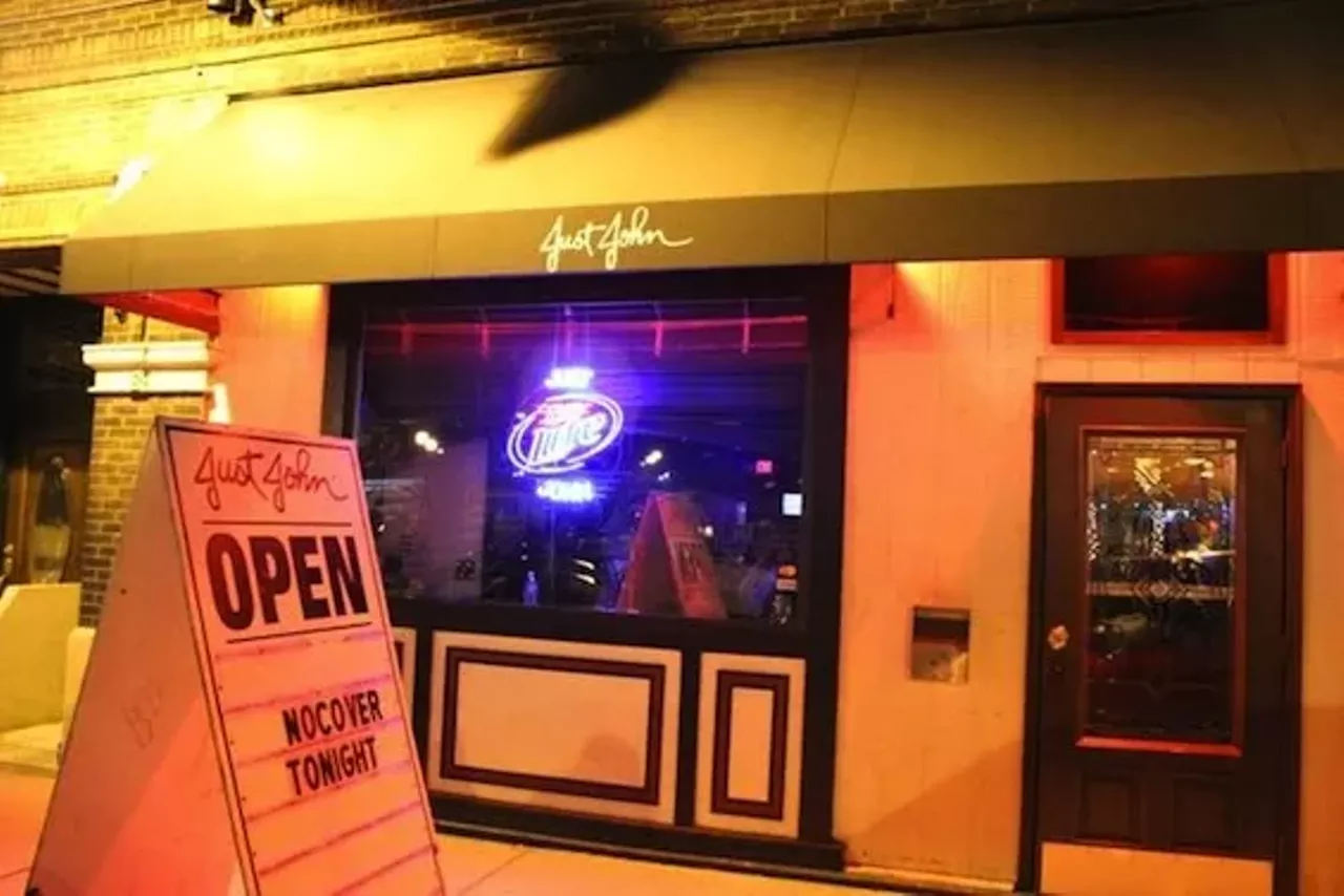 Just John What makes a gay bar great? Stiff ones? (We mean drinks, you pervert!) Hot dudes? Atmosphere? Yes, all of that, plus something else: the unquantifiable feeling of being where the action is. Just John's, or JuJo for those in the know, is owned by two lovely men who've been partners for fifteen years. You've seen their float in Pride. You'll see plenty of regulars and staff at Out in the Ballpark. Go have a beer on the patio or take in the slick, swank indoor space and find out why Just John's is everyone's favorite spot. It isn't just a bar; it's part of the fabric of the community.