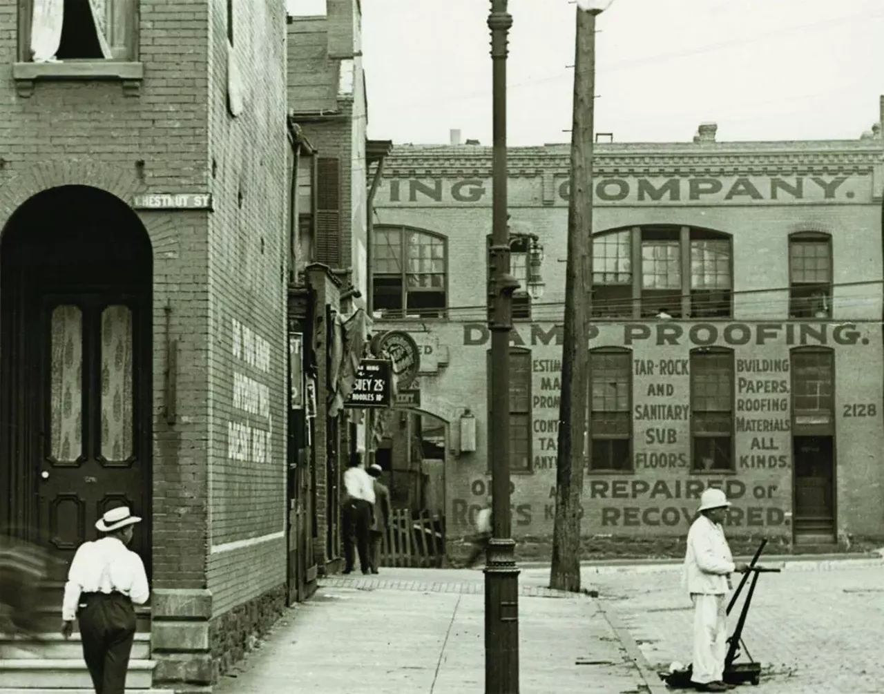 Street cleaner at Twenty-First and Chestnut streets. Photograph, ca. 1900.