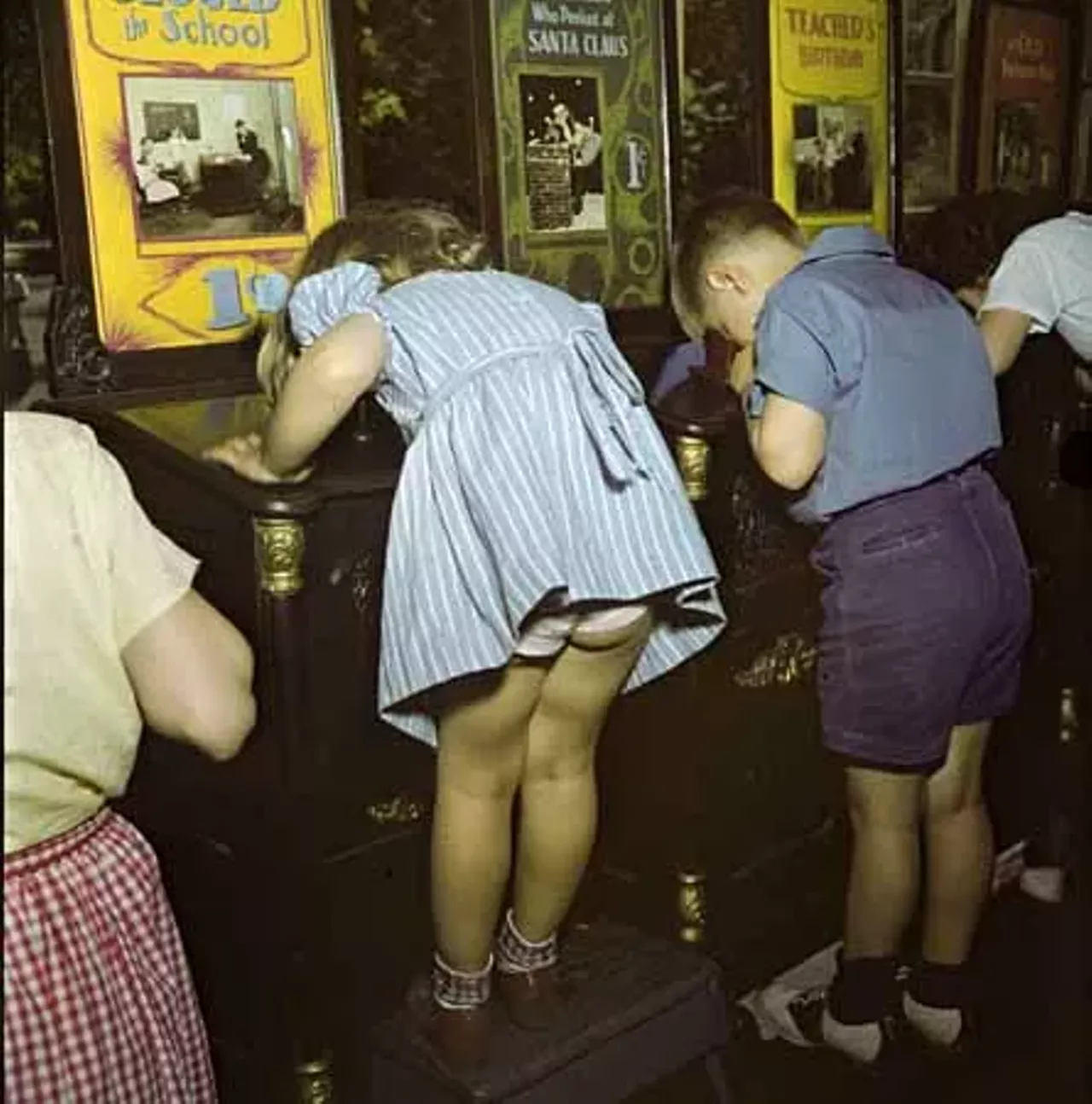 1947. More play time at the arcade.