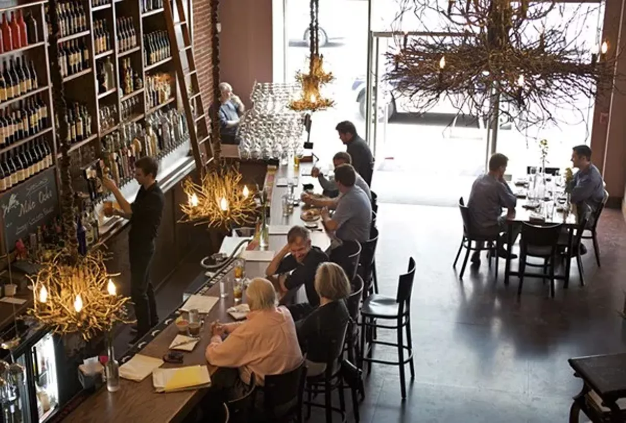 Bridge Tap House & Wine Bar (1004 Locust Street; 314-241-8141) "You enter into the bar, a space that is awesome in the original sense of the word: Light fixtures like oversize birds' nests are suspended from the ceiling. So, too, precariously, or so it seems when a breezes sways them, are racks of wine glasses. The bar itself is a handsome wooden structure, high shelves stocked with beer, wine and liquor bottles. There is the obligatory flat-screen TV in one corner, but this is unobtrusive, even during a Cards game." - Ian Froeb Photo credit: Jennifer Silverberg