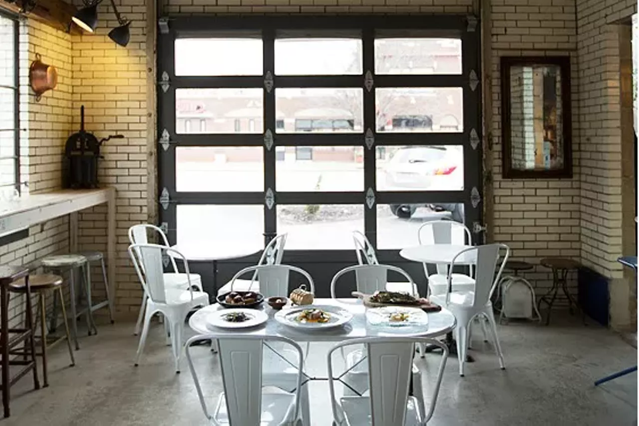 Olio (1634 Tower Grove Avenue; 314-932-1088) "Olio's transformation from a 90-year-old Standard Oil gas station into an inviting wine bar is even more dramatic than Elaia's renovation. The refurbished fa&ccedil;ade of red and white tiles frames tall windows and the garage bay. The warmly lighted interior features exposed brick, with weathered wooden shelves adding yet more character. You can sit at the bar (which includes Olio's own, very small kitchen), at a counter that lines the front windows or in one of the freestanding tables in the garage bay." - Ian Froeb Photo credit: Jennifer Silverberg