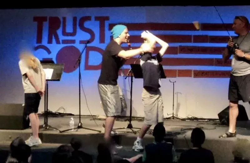 In a June 2012 photo, Brandon Milburn directs middle school and teen boys during First Christina's annual Vacation Bible School. (The photo, which has been altered to blur the faces of minors, was provided by a concerned former church member.) - PROVIDED PHOTO
