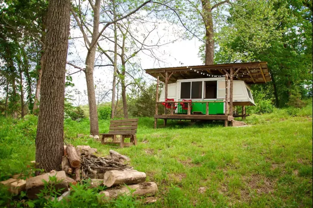 Vintage Camper Rental Ideal for Glamping "This vintage camper rental is perfect for up to four guests to go glamping in Missouri! The camper contains two double beds. There is no running water in the bus, but there is a composting toilet and shower house on the property. All bedding and towels are provided for guests' comfort and convenience." Book this unit on GlampingHub.com