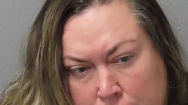 Booking photo of Dara Daugherty, sued today by the city.