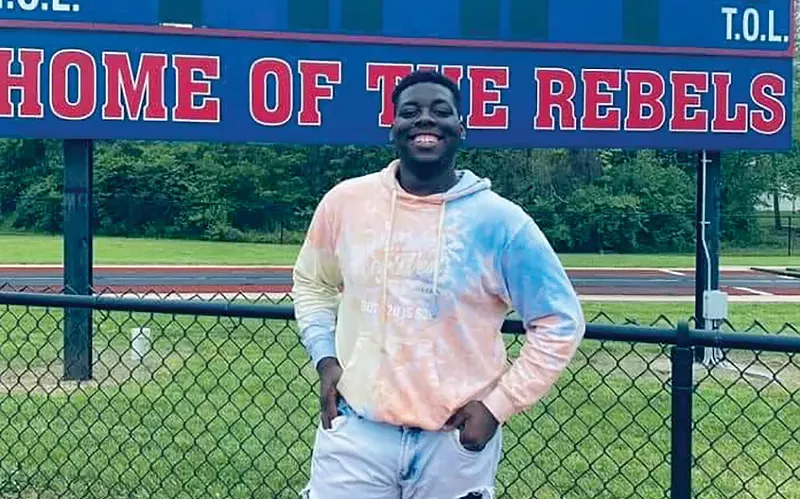 Derontae Martin at his high school football field. - COURTESY ERICKA LOTTS