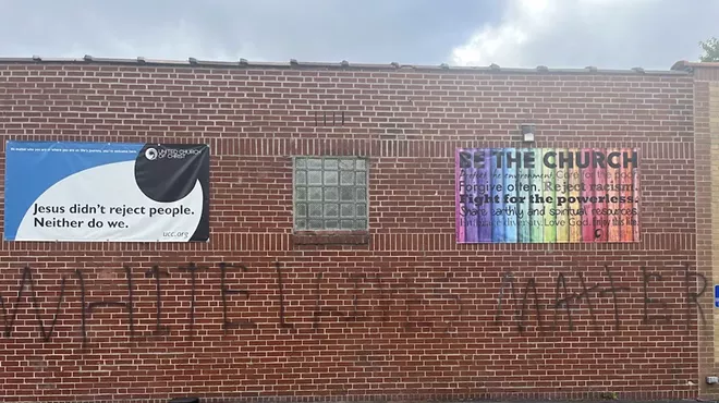 The graffiti covers a large portion of Grace United Church of Christ's exterior wall.
