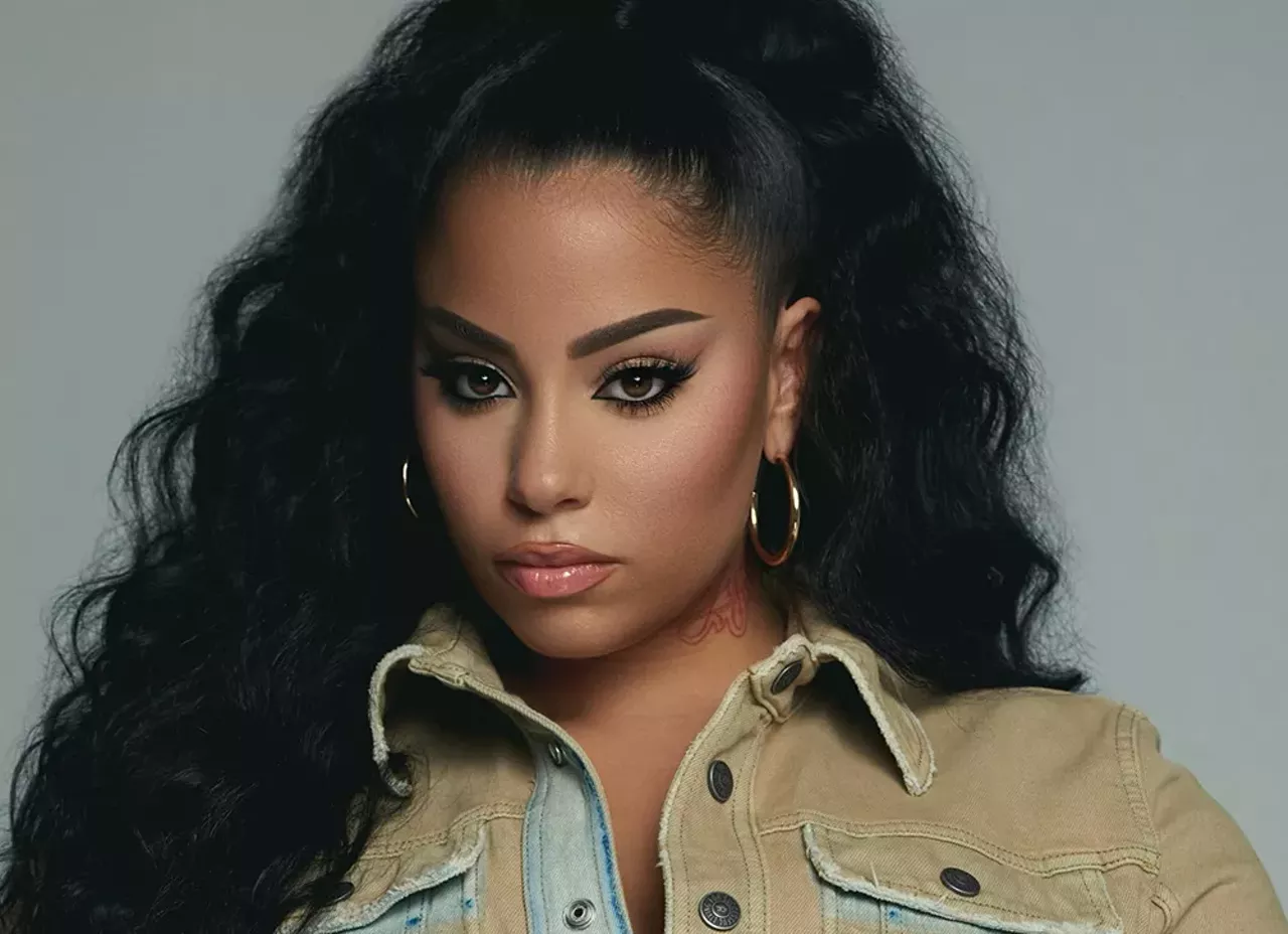Layton Greene Singer Layton Greene, originally from East St. Louis, Illinois, is best known for her single &ldquo;Leave Em Alone&rdquo; featuring Lil Baby, PnB Rock and City Girls. But she first found fame when her cover of Kodak Black&rsquo;s &ldquo;Roll in Peace&rdquo; was discovered on TikTok. At the time, she was working at Walmart and trying to get her GED. "The first day when my phone was blowing up, it was going off the hook. I left Walmart, I left my job and never came back," Greene told the RFT. "Once I went viral, I was like, 'This is it!' Since then she has signed with Quality Control Music in Georgia as its first female R&amp;B artist and released her EP Tell Ya Story.