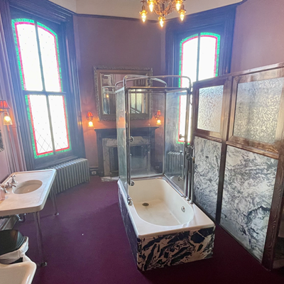 Lemp Mansion The women's bathroom at Lemp Restaurant and Inn (3322 Demenil Place) is one for the ages. By this we simply mean that the bathroom fits the aesthetic of the 1860s, with an authentic bathroom setup and decor — minus the stalls. Two things that caught our attention 1) an actual bathtub in the bathroom — in the middle of the room, mind you; 2) the beautiful wood fireplace. The two-stall, burgundy bathroom feels grand with its high ceilings, chandelier and extra lighting, giant stained-glass windows, rich wood trim, marble and wall-to-wall carpet. Our favorite part is the fact the stall walls go all the way down to the floor and there's real doors on them giving you ultimate privacy while you're pretending to be doing your business in the 1800s.