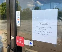 A sign notes a temporary closure, but sources confirm the situation is permanent. - Cheryl Baehr