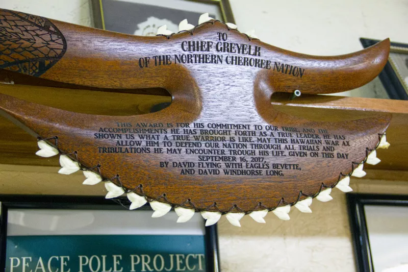 The Northern Cherokee Nation's headquarters are filled with artifacts (like this "Hawaiian War Ax") and other items that ostensibly support its identity as a Native American tribe. - DANNY WICENTOWSKI