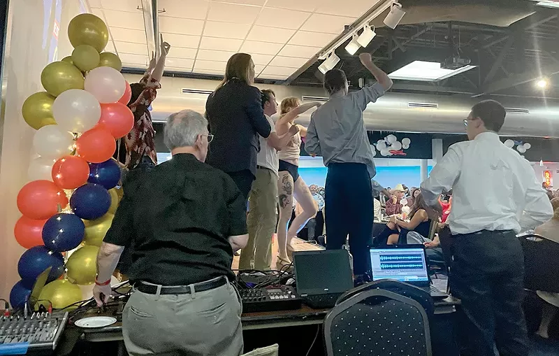 Resist STL protesters stormed the stage at a Coalition Life fundraiser. - VIA RESIST STL
