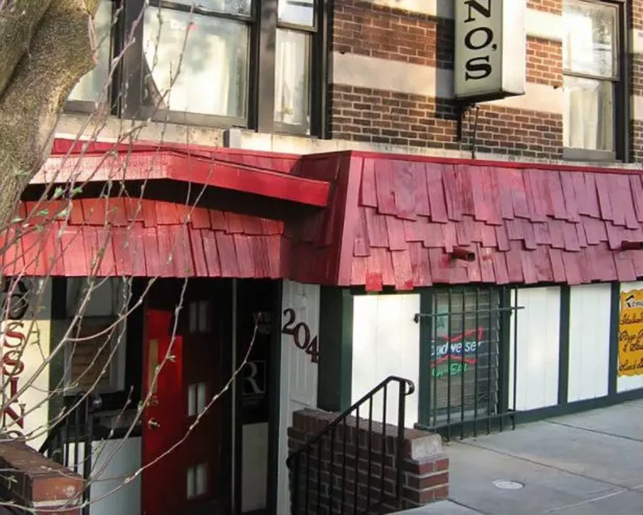Rossino's 206 N. Sarah St. In the basement of this apartment building lived the best little Italian joint: Rossino's. The ceilings were low, the decor was kitchy and the food was great. Rossino's was rumored to be the first pizza place in all of St. Louis. Photo courtesy of Toby Weiss / B.E.L.T. (photo has been cropped )