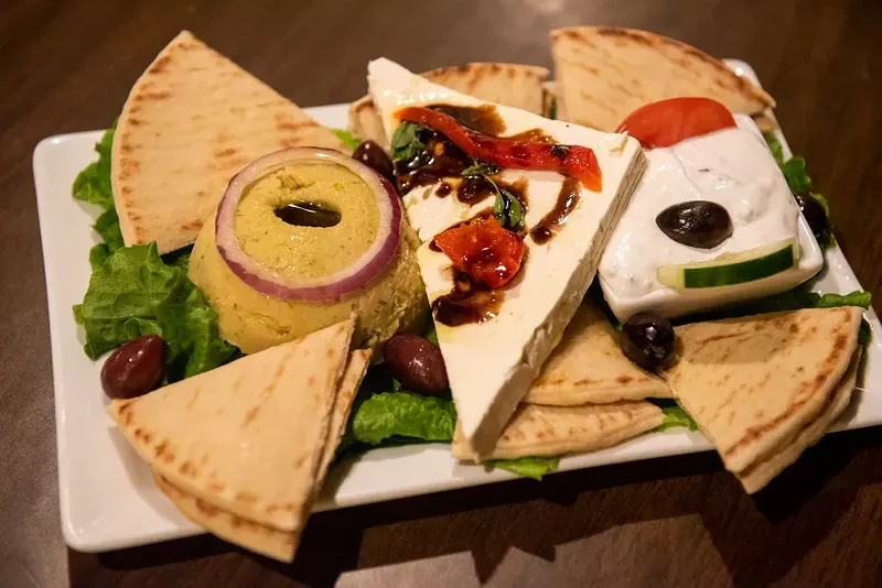 The "Spiro's Cold Platter" includes tzatziki, hummus, kalamata olives, feta cheese and pita bread. - Vu Phong