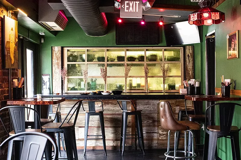 The interior of Stew's is small — but that makes it a perfect spot to huddle to with friends. - MABEL SUEN