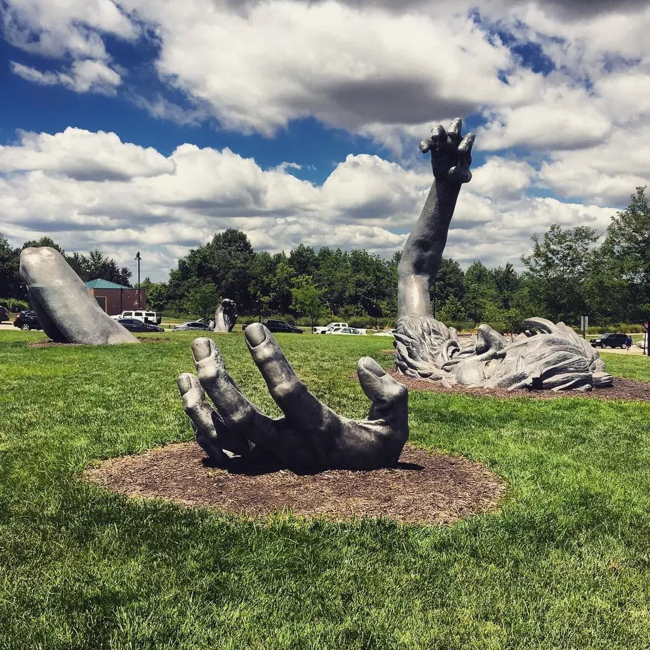 The Awakening - Buried Giant 16150 Park Circle, Chesterfield, MO This sculpture by J. Seward Johnson is supposed to be of a giant crawling out of the ground. It lives right behind Chesterfield Mall and it's huge, weirdly stressful and tons of fun to climb on. Photo courtesy of jkinzy / Instagram