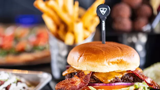 Topgolf's Smokehouse burger comes with bacon, barbecue sauce, cheddar, lettuce, tomato, onion and secret sauce.