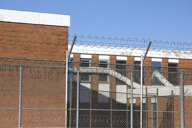 Air-conditioning tubes installed last month run into the windows of the Workhouse, providing relief for overheated prisoners. - Photo by Danny Wicentowski