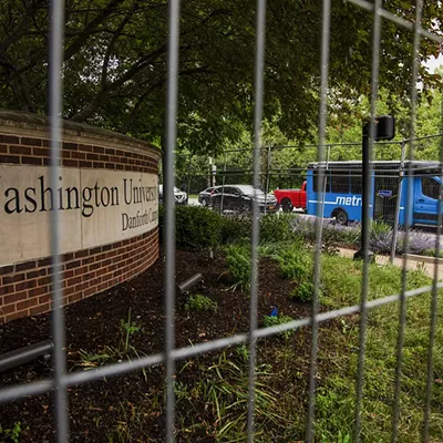 A metal fence surrounds Wash U’s Danforth Campus.